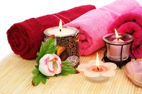 Towels, soap, flowers, candles