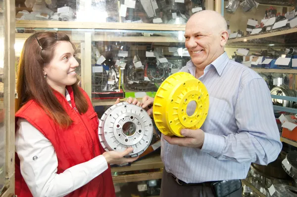 Man buys brake wheel in auto parts store