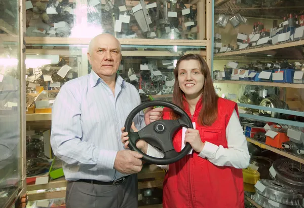 Man and woman in auto parts store