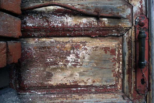 Old painted wooden door with handle