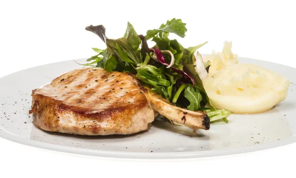 Grilled pork with salad and potato