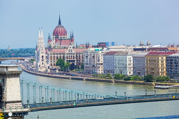 View of a building of the Hungarian parliament, Danube and chain Secheni Bridge