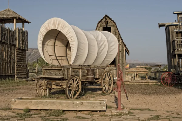 Western covered wagon on yard of Fort