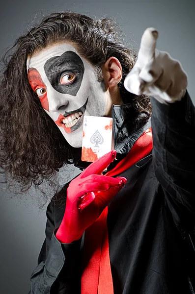 Joker with face mask in studio