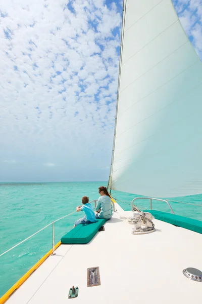Family sailing on luxury yacht