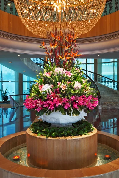 The crystal chandelier and flower bed - a vase