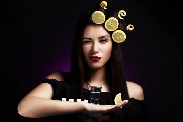 Sexy woman with lemons in her hairstyle