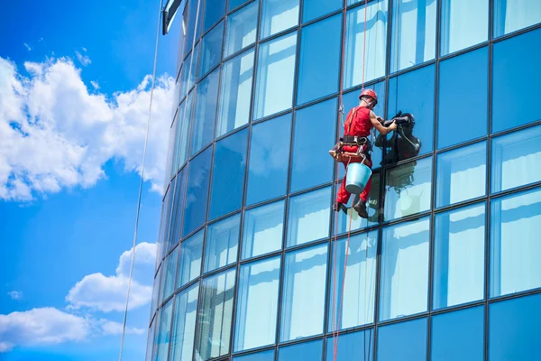 Window washer building windows from outside