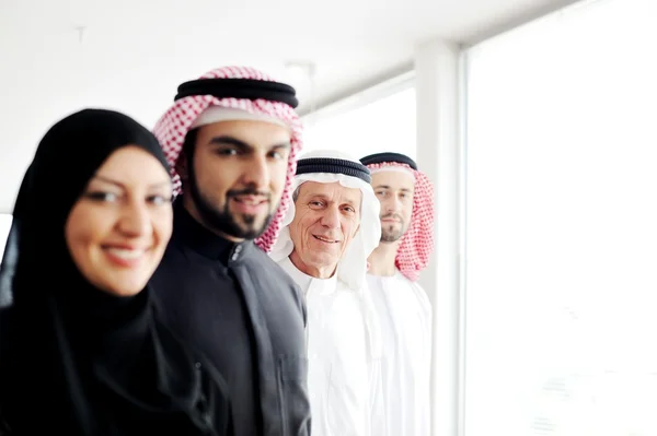 Successful and happy business arabic looking at you