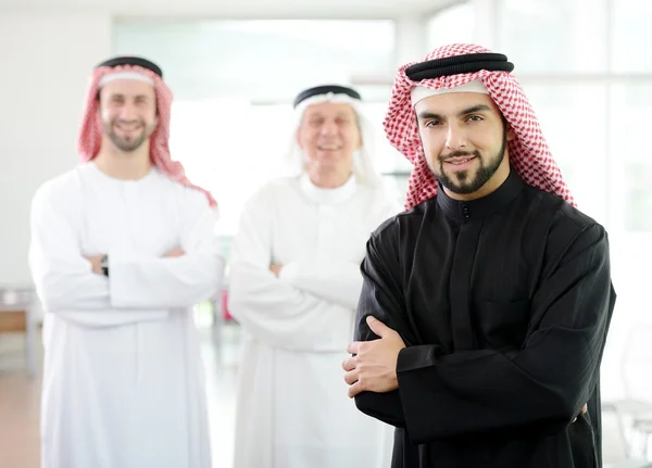 Happy Saudi man at work