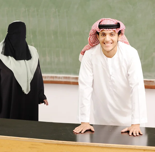 Smiling young success man, arabic traditional clothes, education