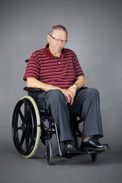 Sad senior man in wheelchair