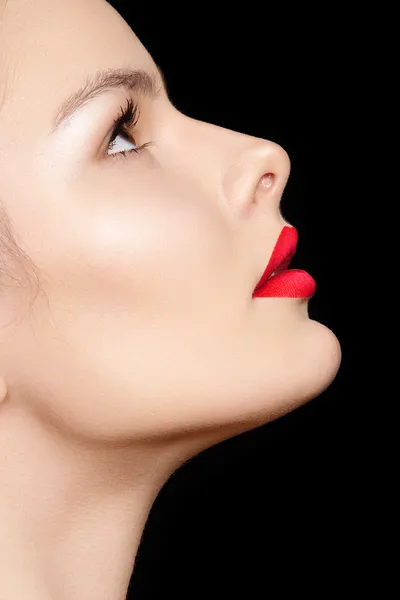 Close-up side view of beauty with clean skin & bright make-up. Chic fashion woman model