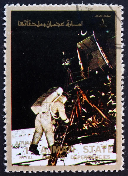 Postage stamp Ajman 1973 Aldrin Stepping out of the Eagle