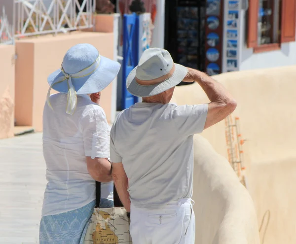 Couple of tourists, Oia, Santorini, Greece