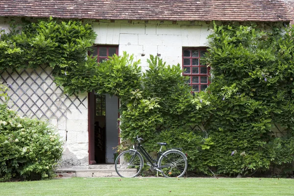 Bike near the entrance in a traditional house, France