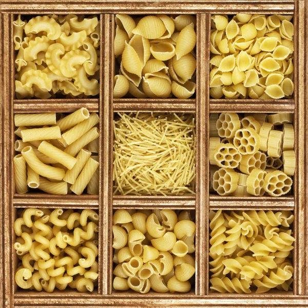 Different kinds of italian pasta in wooden box catalog