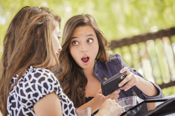 Shocked Mixed Race Girls Working on Electronic Devices