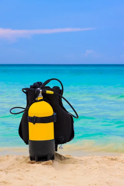 Scuba diving equipment on a beach