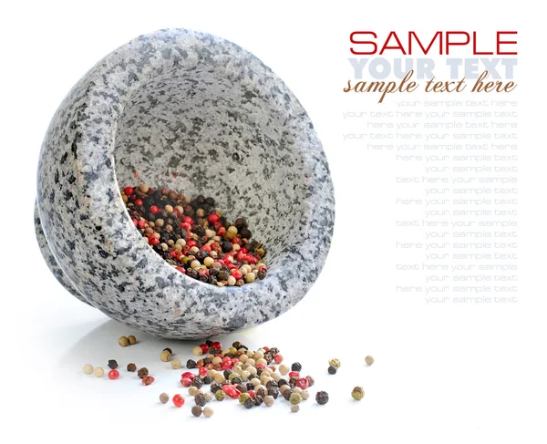 Stone mortar with mixture of peppers on white background