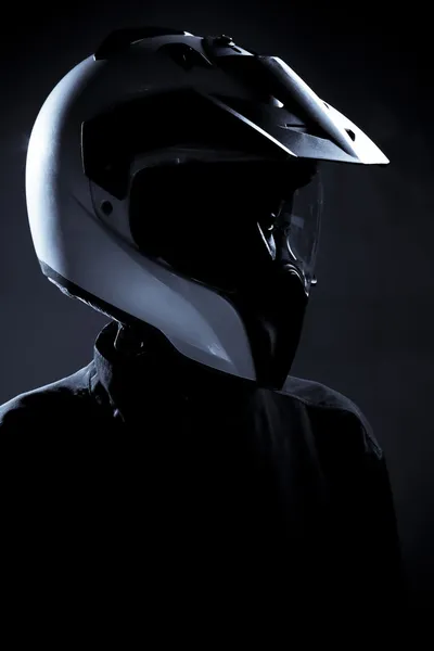 Motorcycle biker rider with protective helmet