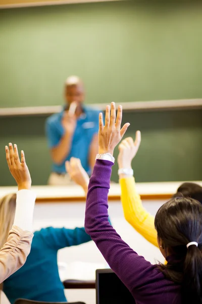 Students arms up in classroom