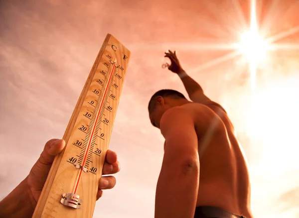 Man throwing water for cooling temperature and hand holding thermometer under heat weather