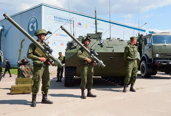 Soldiers demonstrate military equipment