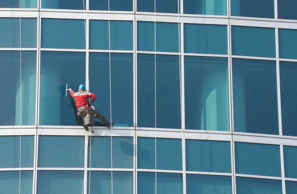 Window cleaner at work