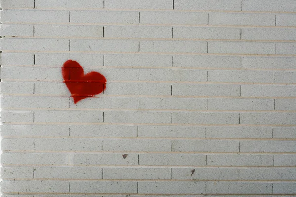 Painted heart on brick wall
