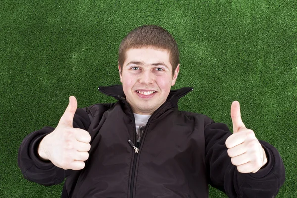 Young man with thumbs up
