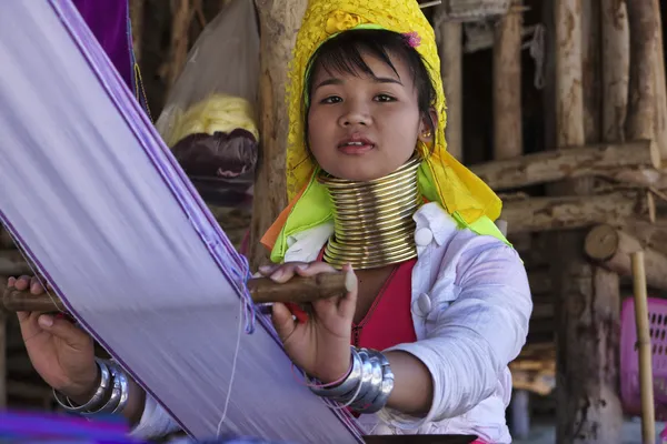 Thailand, Chiang Mai, Karen Long Neck hill tribe village (Baan Tong Lhoung), Long Neck woman in traditional costumes. Women put brass rings on their neck when they are 5 or 6 years old and increase th