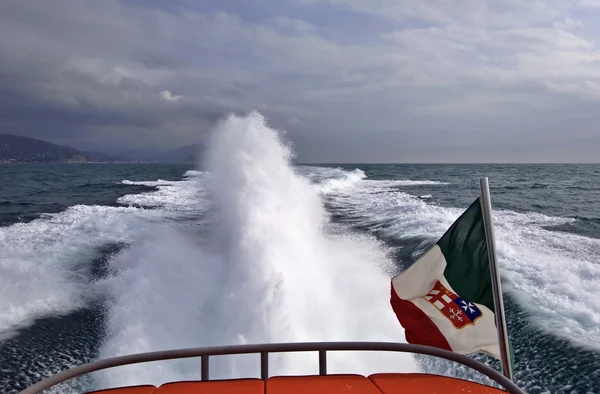 Italy, Tyrrhenian Sea, luxury yacht at full speed, backwash