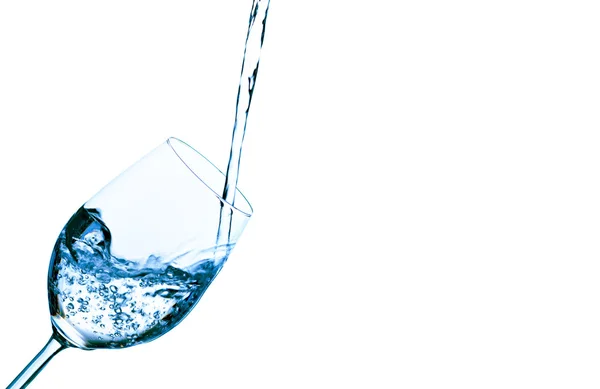Water is filled into a glass of water