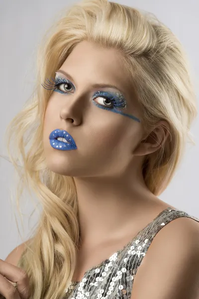 Blonde girl with euro flag make-up, she is turned of three quart