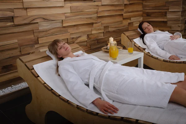 Spa room two women relax after treatment