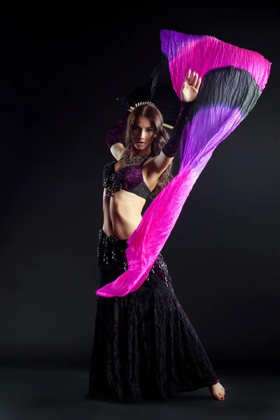 Sexy young woman dancing oriental dance