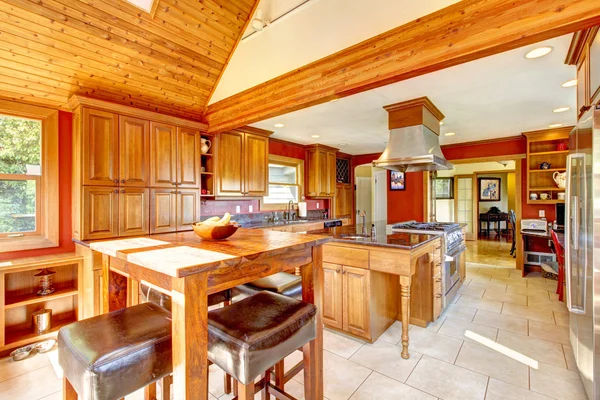 Red large luxury kitchen interior with beautiful wood.