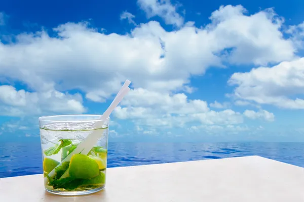Mojito cocktail drink in summer blue calm sea