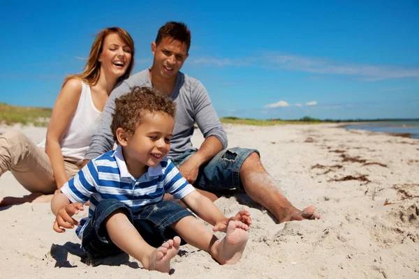 Family Enjoys Vacation on a Beach