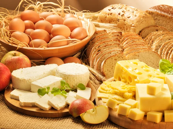 Dairy food, eggs, breads, cheese and apples