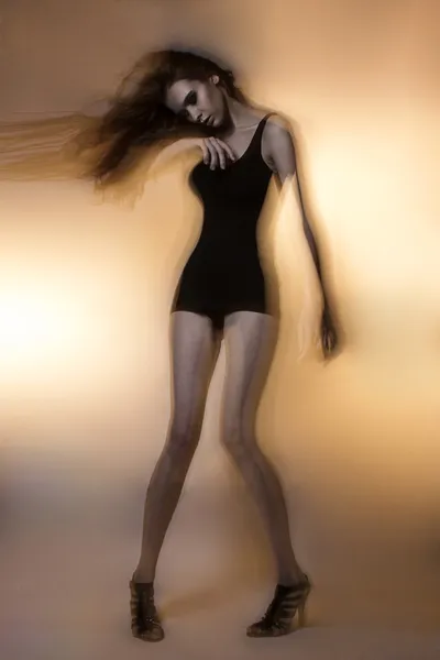 Young beautiful Russian model slim studio test posing dancing portrait long hair