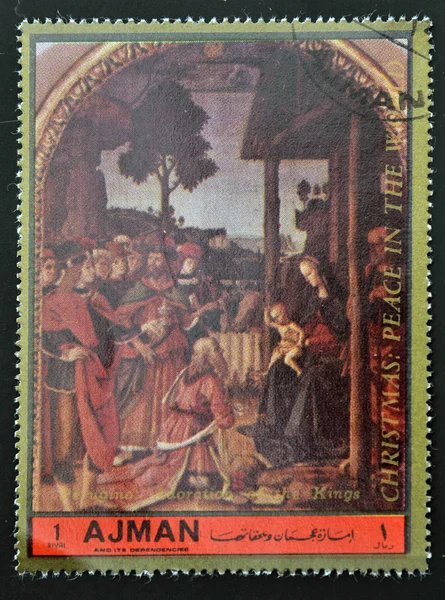 AJMAN - CIRCA 1972: A stamp printed in Ajman Christmas collection, peace in the world, shows the Adoration of the Magi painted by Perugino , circa 1972
