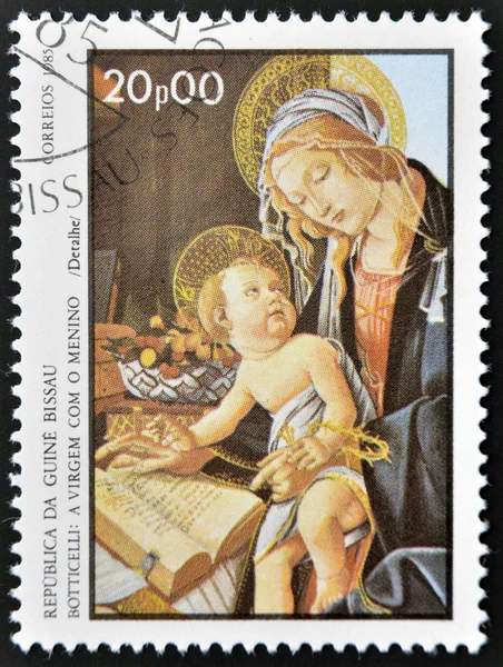 GUINEA BISSAU - CIRCA 1985: a stamp printed in Guinea-Bissau showsthe Virgin and Child by Botticelli, circa 1985