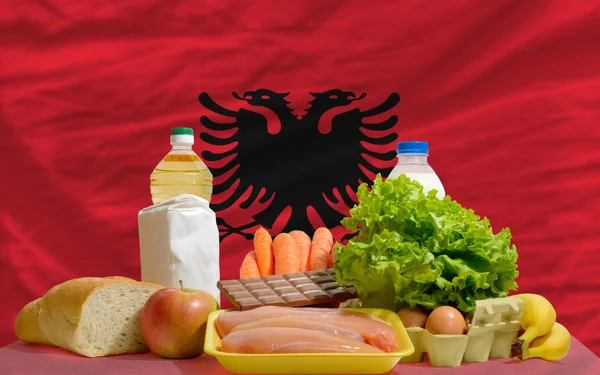 Basic food groceries in front of albania national flag