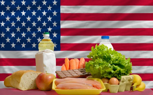 Basic food groceries in front of america national flag