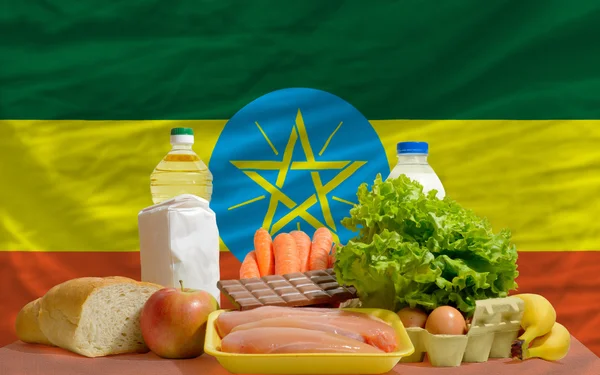 Basic food groceries in front of ethiopia national flag
