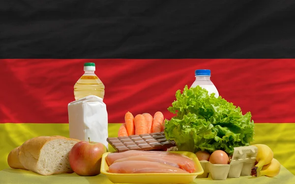 Basic food groceries in front of germany national flag