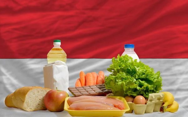 Basic food groceries in front of indonesia national flag