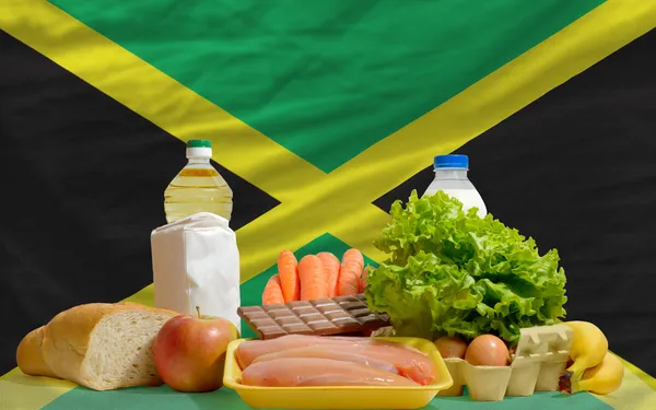 Basic food groceries in front of jamaica national flag